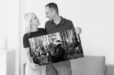 man woman holding photo canvasbn